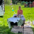 Holistic therapy treatment at an outdoor community event